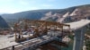 Builders work on the construction of the Pocitelj Bridge in southern Bosnia-Herzegovina within the framework of the Corridor Vc project, which is part of the country's ongoing efforts to improve its transport infrastructure. (file photo)