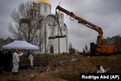 Эксгумация тел погибших в Буче.