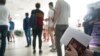 Russians wait to register at a public service center in Almaty in September 2022 after fleeing their country.