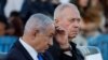 Israeli Prime Minister Benjamin Netanyahu (left) and Defense Minister Yoav Gallant attend a military ceremony at an army base on October 31.