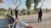 Pakistani soldiers stand guard on a road leading to the cantonment area in Bannu on December 20.