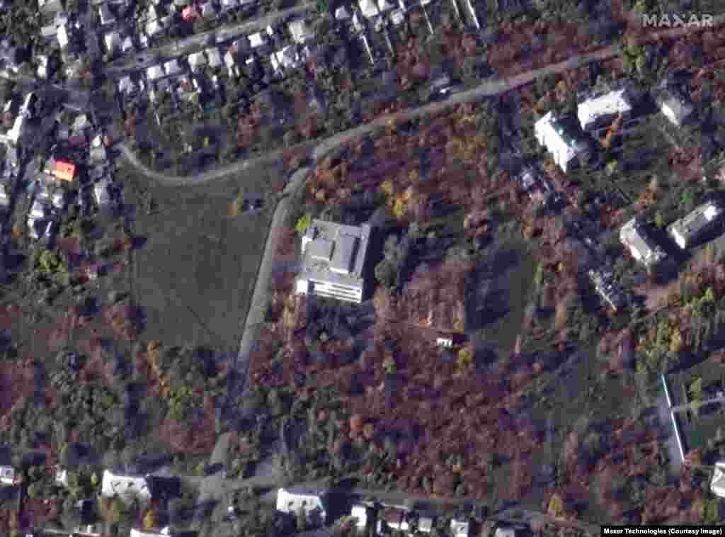 This November 2022 file photo shows the three-story building that was targeted in a western suburb of Makiyivka. Another soldier’s wife told North.Realities her husband gave her a gruesome description of how he “miraculously survived” after running out of the building after the first of four rockets struck. Russia's Defense Ministry also reported four rockets struck the building, while two were shot down. 