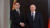 Turkmen President Serdar Berdymukhammedov (left) and Russian President Vladimir Putin shake hands during a meeting on the sidelines of the Shanghai Cooperation Organization in Samarkand, Uzbekistan, on September 15.
