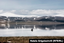 Fishermen take a boat out on a lake in Javakheti in winter.