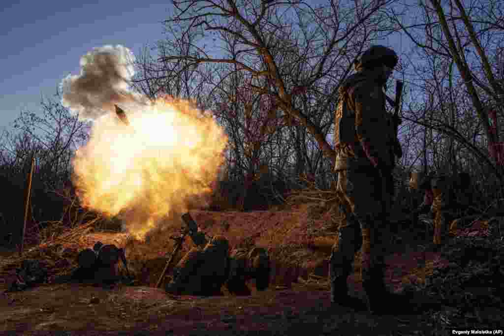 Ukrainian soldiers near Bakhmut fire mortars toward Russian positions on January 11. The assaults on Bakhmut are being led by soldiers from Russia&#39;s notorious private mercenary company the Vagner Group, according to Ukrainian, Western, and Russian officials. Some reports point to World War I-style &quot;human wave&quot; infantry attacks.