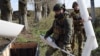 Ukrainian drone operators "Guard" and "Kim" pack up a drone in the Kharkiv region on October 22.
