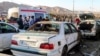 People gather at the scene of deadly explosions that occurred during a ceremony held to mark the death of late Iranian General Qasem Soleimani in Kerman, Iran, on January 3. 