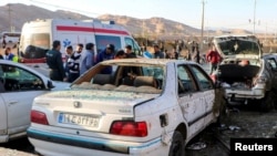 People gather at the scene of deadly explosions that occurred during a ceremony held to mark the death of late Iranian General Qasem Soleimani in Kerman, Iran, on January 3. 