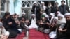 Sufi leader Abdul Waheed Bahaduri (center) prays in a mosque in Kabul.
