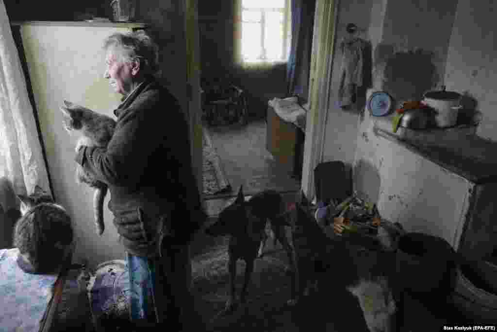 Natalya, a resident of Avdiyivka, inside her home a few kilometers from the front lines on January 26. She was severely injured during fighting in January 2017. 