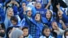 Female fans of Iran's Esteghlal football club cheer during a match between Esteghlal and Mes-e Kerman at Azadi Stadium in Tehran on August 25. It was the first time Iranian women were allowed to attend a national football championship match since the 1979 Islamic Revolution.