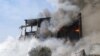 An unknown number of people were trapped under rubble after a blast and subsequent fire at the Surmalu market sent a towering cloud of smoke over Yerevan. 