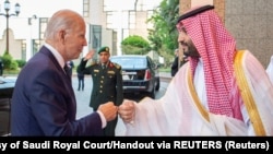 U.S. President Joe Biden avoided appearing to embrace Saudi Crown Prince Muhammad bin Salman, implicated by U.S. intelligence in the brutal 2018 murder of Washington Post journalist Jamal Khashoggi, but a photo of Biden and the crown prince fist bumping circulated worldwide.