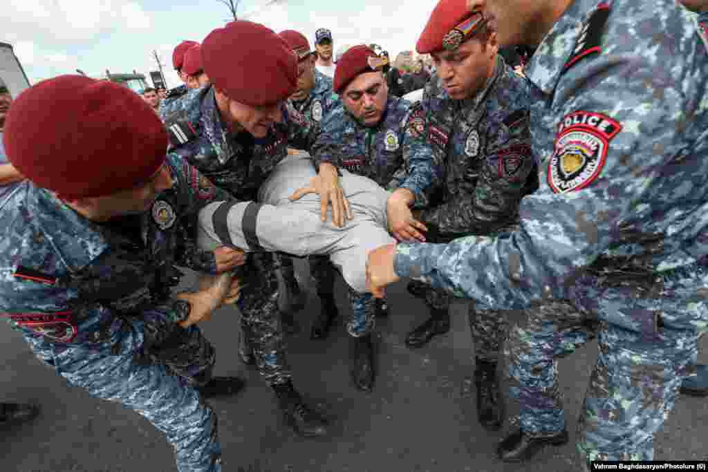 A protester is detained in Yerevan on May 4. Pashinian&#39;s Civil Contract party holds 71 of the legislature&#39;s 101 seats since snap elections were called in June 2021.&nbsp;