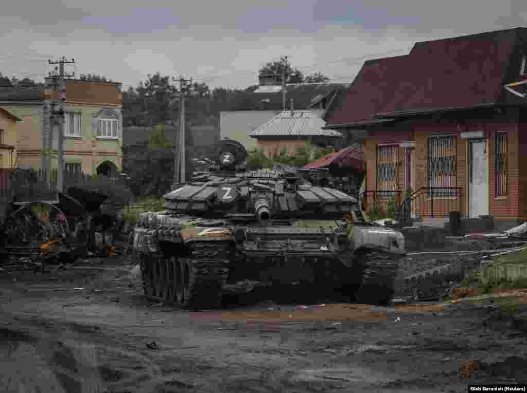 As Russian forces fled, they left behind large quantities of ammunition and hardware such as this tank in Izyum. The loss of Izyum is regarded as a strategic setback for Moscow as its troops had relied on the city as a base and resupply node for its forces in the Kharkiv region.