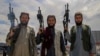 Taliban fighters patrol in Kabul on May 30.