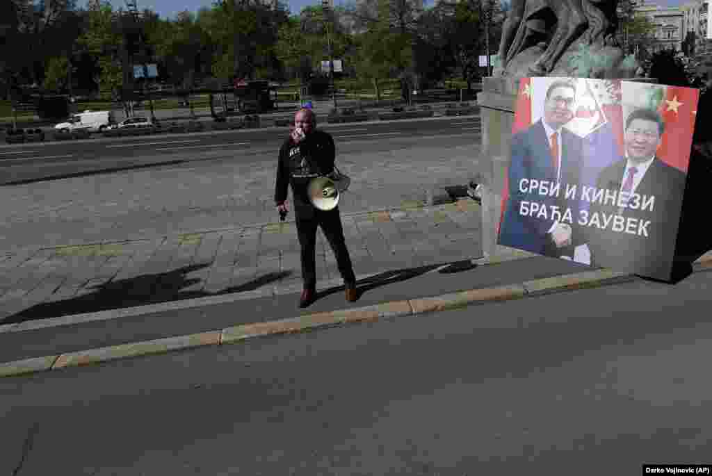 A protester outside Serbia’s National Assembly alongside a sign showing Serbian President Aleksandar Vucic and President Xi that reads, “Serbs And Chinese, Brothers Forever,” on April 28. During a video summit this month, the EU announced a “robust economic investment” for Balkan countries, on top of the 3.3 billion euros ($3.6 billion) in emergency funding the EU had already earmarked for the region. “The Western Balkans belongs in the EU and there is no question for us about it,” European Commission President Ursula von der Leyen said after the summit. 