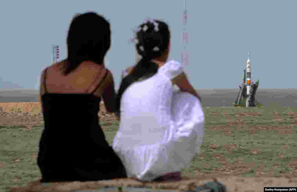Kazakh girls watch as a Soyuz rocket prepares for launch in 2009. As work continues on Russia&rsquo;s troubled Vostochny Cosmodrome and SpaceX aims to ferry astronauts to the ISS from U.S. soil beginning on May 27, Kazakhstan&#39;s aging launch facility and the population it supports is likely to be left behind. &nbsp;