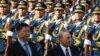 Kazakh President Nursultan Nazarbayev (R) reviews a military honor guard with Chinese President Xi Jinping at a welcome ceremony outside the Great Hall of the People in Beijing on June 7.