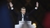 France -- French president-elect Emmanuel Macron greets supporters as he arrives to deliver a speech in front of the Pyramid at the Louvre Museum in Paris on May 7, 2017, after the second round of the French presidential election.