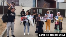 Protesters rally outside the embassy in Nur-Sultan on June 8.