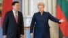 Then-Lithuanian President Dalia Grybauskaite (right) welcomes Chinese National People's Congress Chairman Zhang Dejiang prior to their meeting in Vilnius in April 2017.