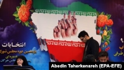 Iranians register for the upcoming parliamentary elections at the Interior Ministry in Tehran in December.