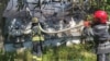Firefighters extinguish a blaze at a logistics hub after a Russian missile strike on Odesa on June 20.