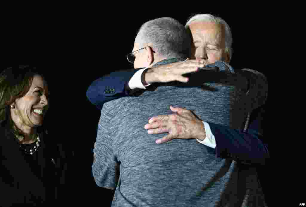 Harris smiles as Biden hugs Whelan as he arrived on August 1. Whelan, who also holds British, Canadian, and Irish citizenship, had been designated by the U.S. government as wrongfully detained.