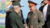 Russian Defense Minister Sergei Shoigu meets with the chief of staff of Iran's armed forces, Mohammad Bagheri, in Tehran on September 19. 