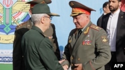 Russian Defense Minister Sergei Shoigu meets with the chief of staff of Iran's armed forces, Mohammad Bagheri, in Tehran on September 19. 