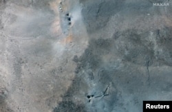 Holes left by bunker-buster bombs dropped from B-2 aircraft at the Fordow underground nuclear complex near Qom in Iran.