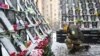 Во время акции памяти Небесной Сотни в центре Киева. Украина, 18 февраля 2021 года