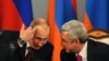 Armenia -- Russian President Vladimir Putin (L) speaks with his Armenian counterpart Serzh Sarkisian during a signing ceremony in Yerevan, December 2, 2013