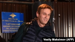 Russian opposition leader Aleksei Navalny leaves a detention center in Moscow early on October 14.