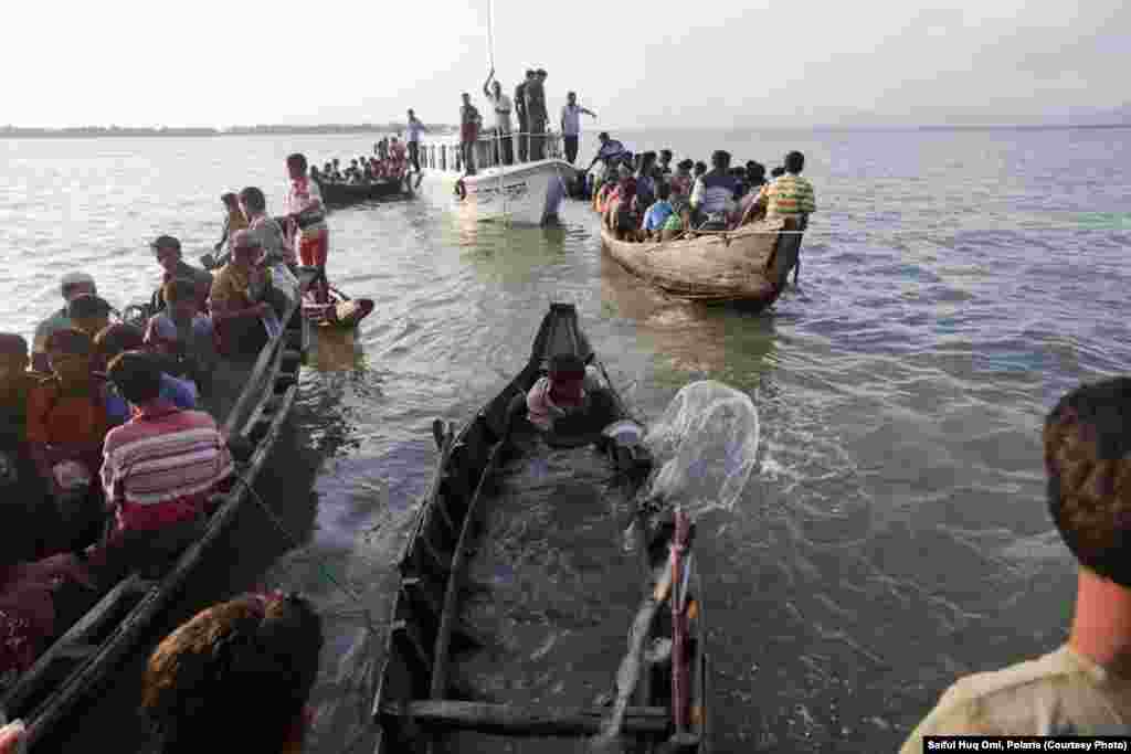 Crossing the river in wooden boats, the refugees are fleeing sectarian violence in western Burma.