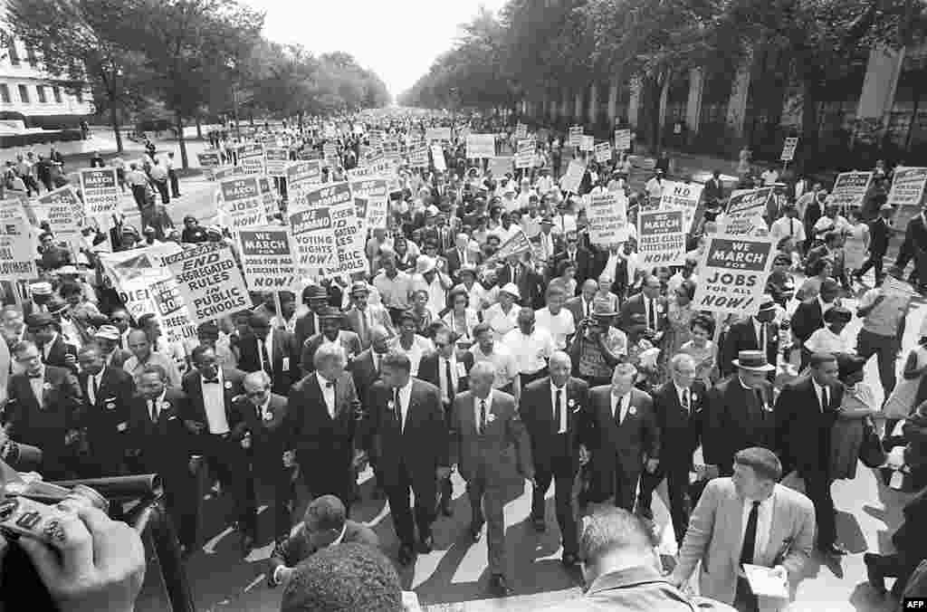 Civil rights leader and clergyman Dr. Martin Luther King Jr. (third from left) marches with other civil rights leaders in the March on Washington for Jobs and Freedom on August 28, 1963. More than 200,000 activists took part in the march, which King described as "the greatest demonstration of freedom in the history of the United States."
