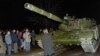 A Lithuanian demonstrator stands in front of a Soviet Army tank during the assault on the Lithuanian Radio and Television station in Vilnius on January 13, 1991. 