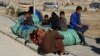 'From One Grave To Another': Afghan Hazara Find Little Solace In Escape