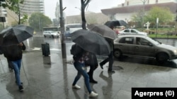Romanians brace against the rain as authorities put areas of the country on high flood alert and ordered some evacuations on September 29, less than three weeks after deadly flooding.
