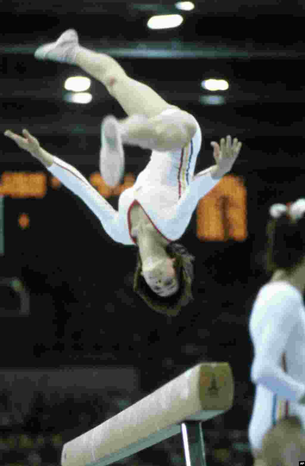 Romania’s Nadia Comaneci flipping toward another in her string of perfect 10s, this time on the balance beam. Her first perfect 10s were awarded at the Olympics in Montreal in 1976. She was the first gymnast ever to receive a perfect score.