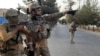 Afghan special forces patrol a deserted street during fighting with the Taliban in Lashkar Gah on August 3.