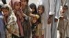 Children displaced by fighting await humanitarian aid in one of Pakistan's tribal districts. The government has failed to back its counterinsurgency with development efforts to win public support. 