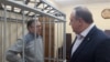 Падсудны Андрэй Галавач і ягоны адвакат Аляксей Швакаў