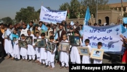 Afghans rally in Herat to support the Doha peace talks between Taliban and the Afghan government on September 21. 