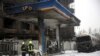 Officials say the fire started at a gas station.