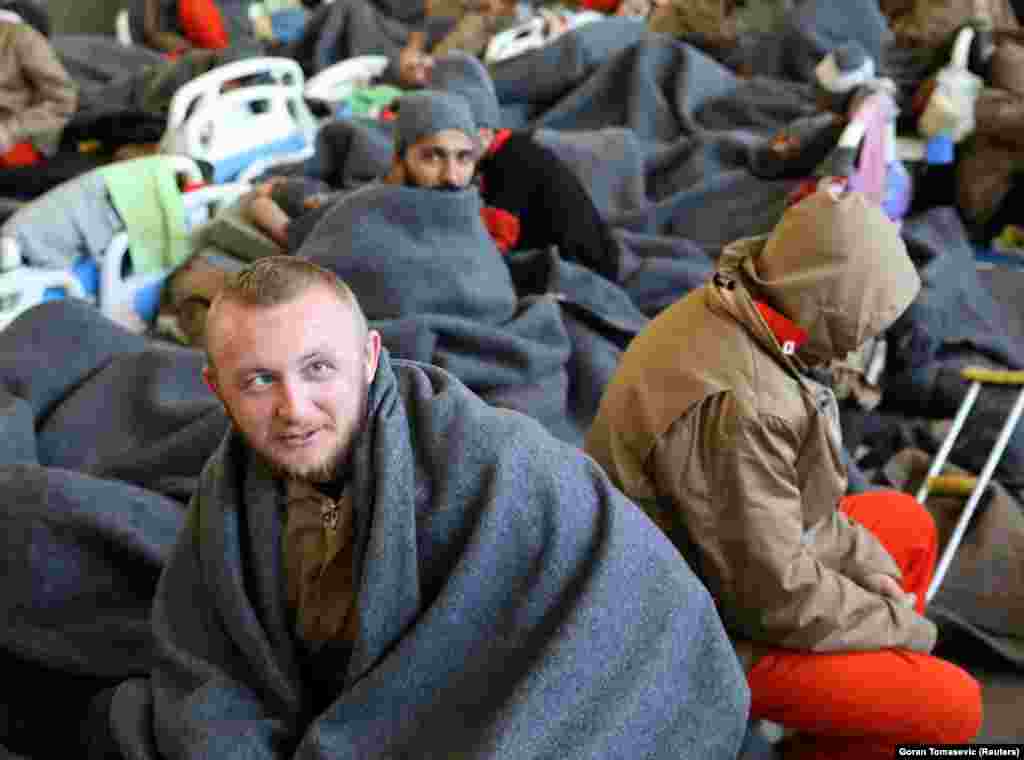 Alija Keserovic, a prisoner from Bosnia and Herzegovina, suspected of being part of the Islamic State, sits inside a prison hospital in Hasaka. 