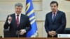 Ukrainian President Petro Poroshenko (left) presents former Georgian President Mikheil Saakashvili as the governor of Odesa on May 30, 2015.