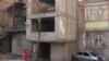Armenia - a building constructed in front of the entrance of a block 