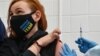 Anna Ilina, a member of the Ukrainian Olympic shooting team for the Tokyo 2020 Olympics, receives a dose of China's Sinovac vaccine in Kyiv on April 15.